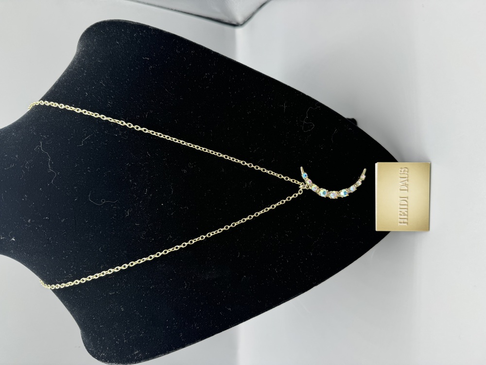 Heidi Daus crescent crystal necklace.